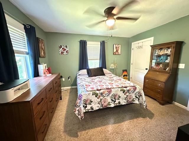 2082 Airport Ridge Rd, Linden, TN 37096 - bedroom with light colored carpet and a ceiling fan