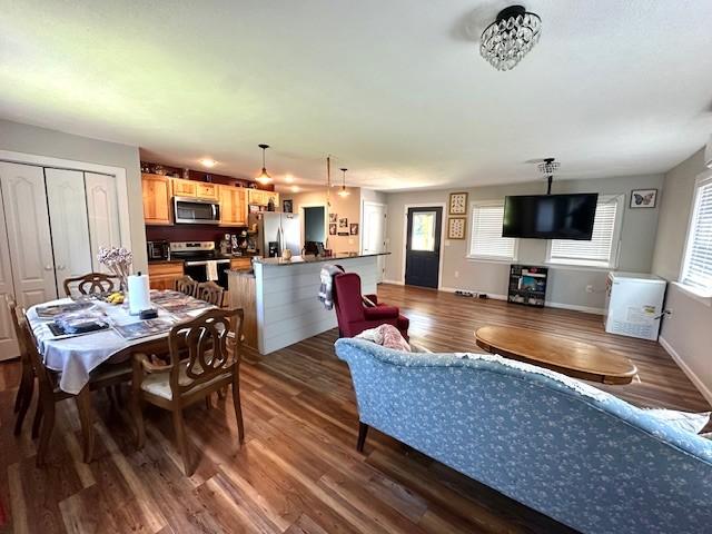 2082 Airport Ridge Rd, Linden, TN 37096 - living area featuring dark wood-style flooring and healthy amount of natural light