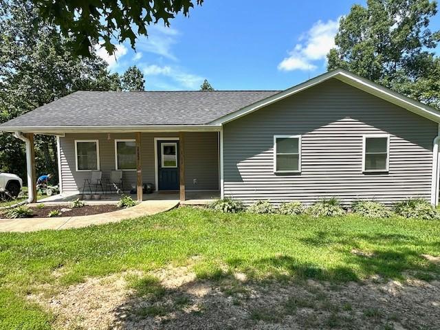 2082 Airport Ridge Rd, Linden, TN 37096 - ranch-style home featuring a front lawn and roof with shingles