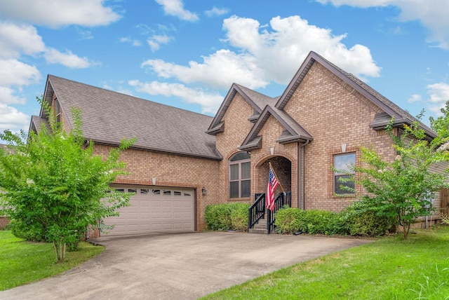 1398 Raven Rd, Clarksville, TN 37042 - view of front of home featuring brick siding, concrete driveway, an attached garage, and roof with shingles
