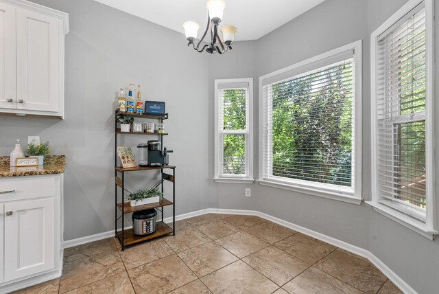 1398 Raven Rd, Clarksville, TN 37042 - dining room featuring a chandelier and light tile patterned floors