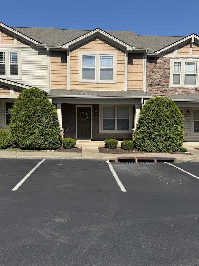 735 Tulip Grove Rd Unit 205, Hermitage, TN 37076 - view of front facade featuring uncovered parking and roof with shingles