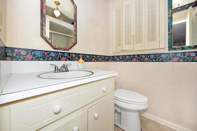 801 E Forrest St, Athens, AL 35611 - bathroom with wallpapered walls, vanity, and a wainscoted wall