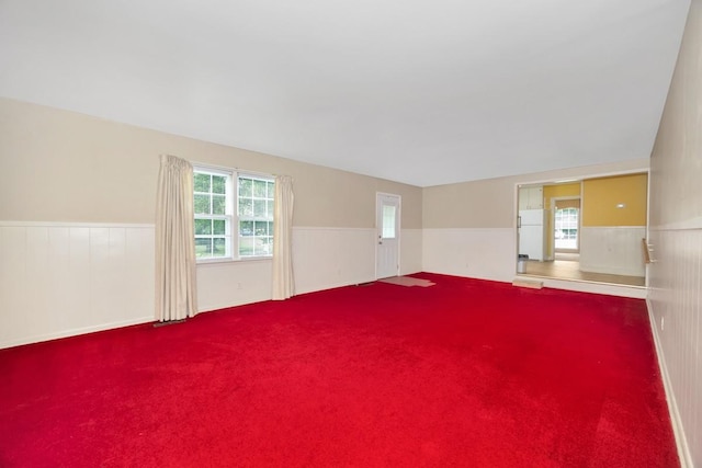 801 E Forrest St, Athens, AL 35611 - carpeted spare room featuring wainscoting