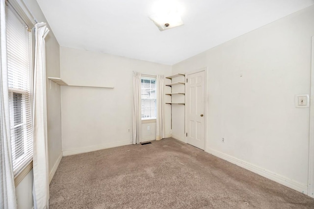 801 E Forrest St, Athens, AL 35611 - unfurnished bedroom with carpet and baseboards