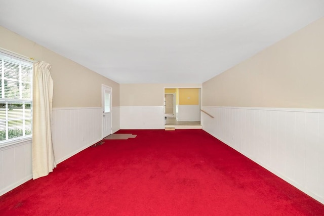 801 E Forrest St, Athens, AL 35611 - carpeted spare room with a wainscoted wall