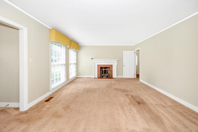 801 E Forrest St, Athens, AL 35611 - unfurnished living room with light colored carpet, a brick fireplace, and crown molding