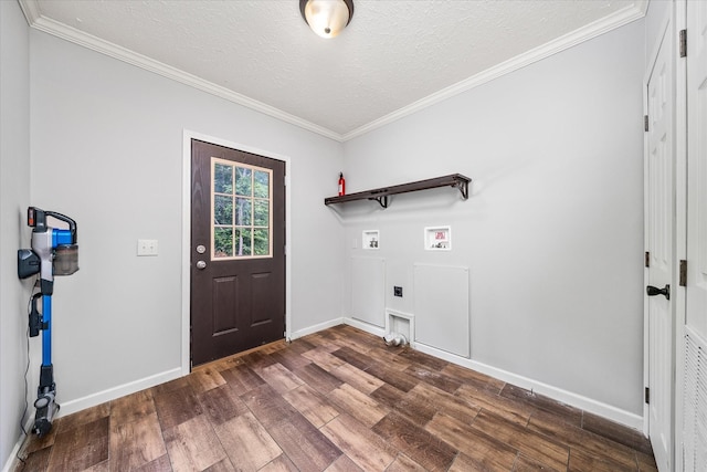 1901 Rickman Rd, Livingston, TN 38570 - laundry room featuring dark wood-style floors, hookup for a washing machine, ornamental molding, a textured ceiling, and hookup for an electric dryer