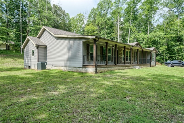 1901 Rickman Rd, Livingston, TN 38570 - view of side of home with a yard, covered porch, and view of wooded area