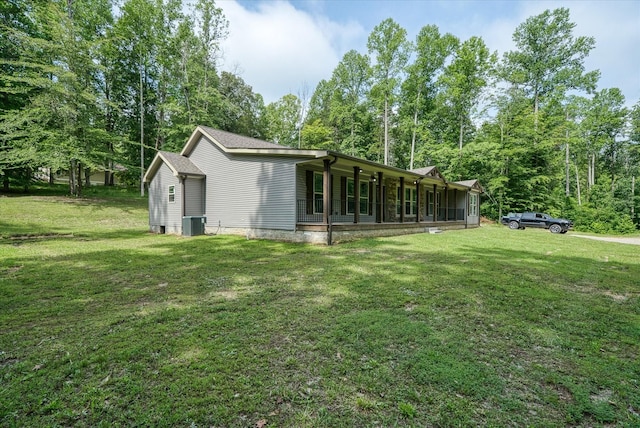 1901 Rickman Rd, Livingston, TN 38570 - rear view of house with a lawn and a porch