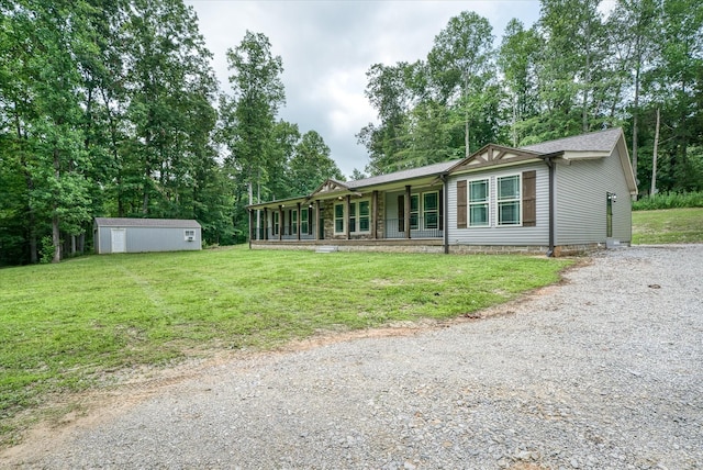 1901 Rickman Rd, Livingston, TN 38570 - view of front of house with a front yard, covered porch, driveway, and view of wooded area
