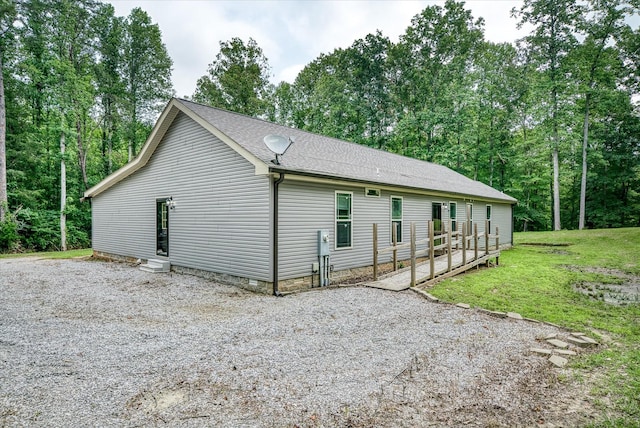 1901 Rickman Rd, Livingston, TN 38570 - view of side of property featuring a shingled roof and a yard