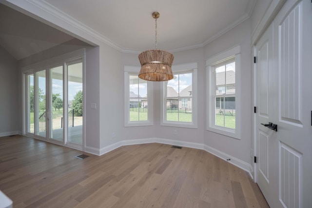 5077B Florence Rd, Murfreesboro, TN 37129 - unfurnished dining area featuring light wood finished floors, a chandelier, and crown molding