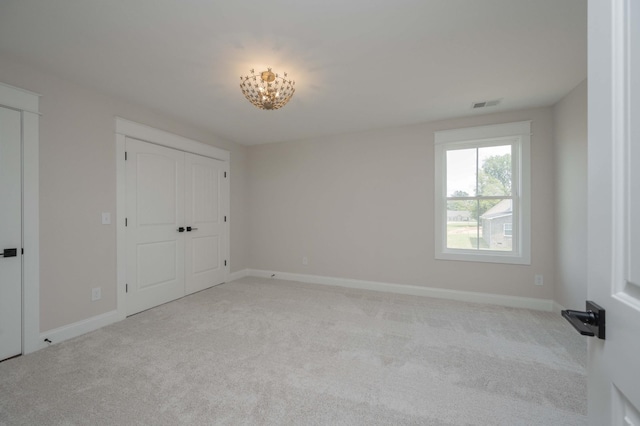 5077B Florence Rd, Murfreesboro, TN 37129 - unfurnished bedroom featuring carpet flooring and a chandelier