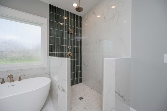 5077B Florence Rd, Murfreesboro, TN 37129 - bathroom featuring a marble finish shower, a freestanding tub, and tile walls