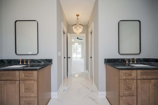 5077B Florence Rd, Murfreesboro, TN 37129 - bathroom with marble finish floors, two vanities, and a chandelier
