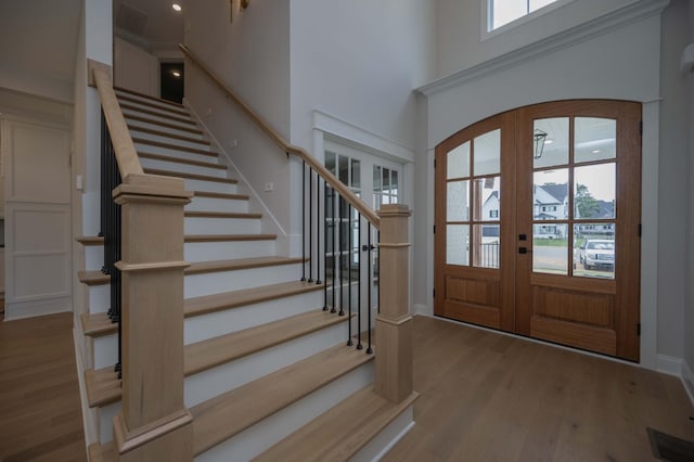 5077B Florence Rd, Murfreesboro, TN 37129 - entryway featuring wood finished floors, stairway, arched walkways, french doors, and a towering ceiling