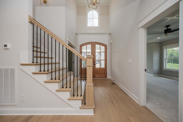 5077B Florence Rd, Murfreesboro, TN 37129 - foyer entrance with wood finished floors, stairway, a ceiling fan, and crown molding