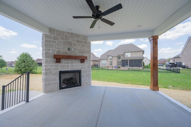 5077B Florence Rd, Murfreesboro, TN 37129 - view of patio featuring an outdoor stone fireplace, a ceiling fan, and a residential view