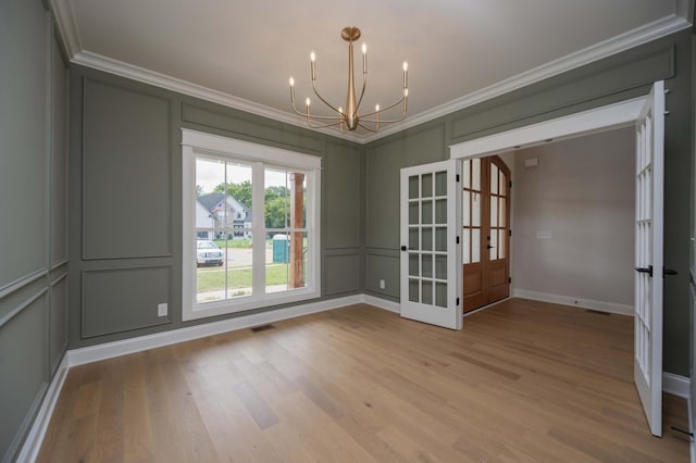5077B Florence Rd, Murfreesboro, TN 37129 - spare room featuring a decorative wall, french doors, ornamental molding, a chandelier, and light wood finished floors