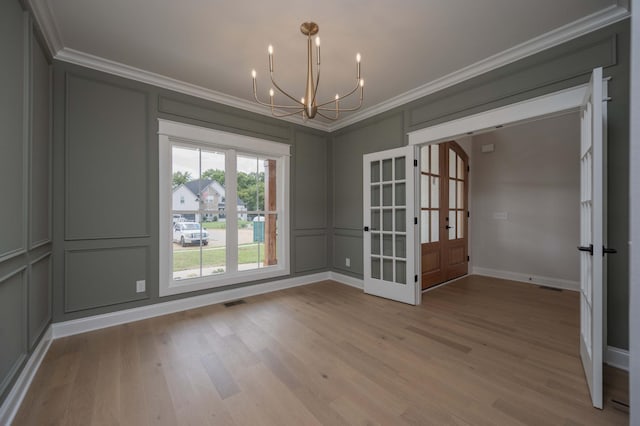 5077B Florence Rd, Murfreesboro, TN 37129 - spare room with french doors, a decorative wall, ornamental molding, a chandelier, and light wood-style flooring