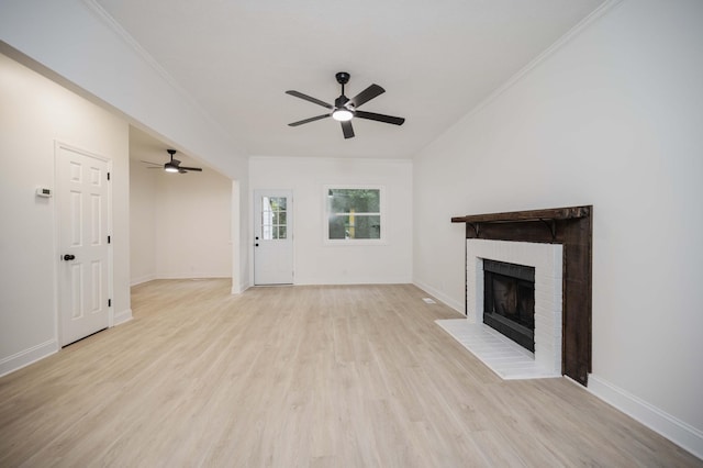 4037 Calumet Dr, Antioch, TN 37013 - unfurnished living room featuring a ceiling fan, a brick fireplace, light wood-style floors, and ornamental molding