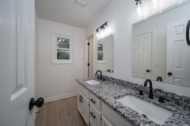 4037 Calumet Dr, Antioch, TN 37013 - bathroom featuring wood finished floors and double vanity