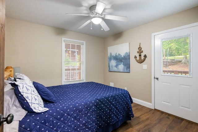 165 Kangaroo Ridge Rd, Byrdstown, TN 38549 - bedroom with wood finished floors, multiple windows, and a ceiling fan