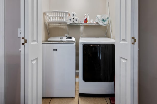 165 Kangaroo Ridge Rd, Byrdstown, TN 38549 - laundry area featuring washer and dryer and light tile patterned floors