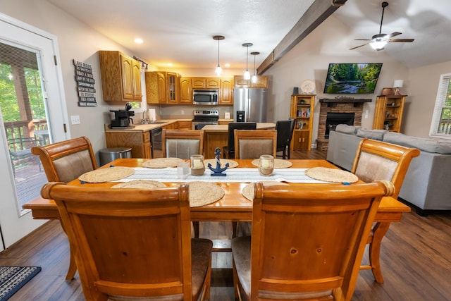 165 Kangaroo Ridge Rd, Byrdstown, TN 38549 - dining room with dark wood finished floors, a ceiling fan, a stone fireplace, recessed lighting, and lofted ceiling