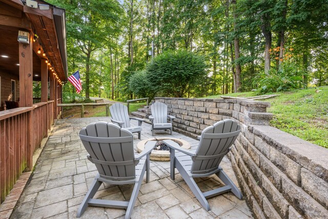 165 Kangaroo Ridge Rd, Byrdstown, TN 38549 - view of patio with a fire pit and view of wooded area