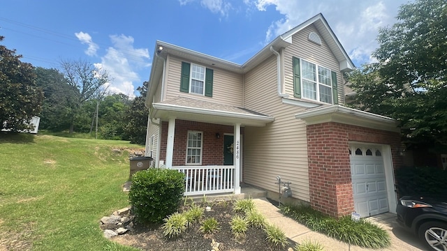 2486 Nashboro Blvd, Nashville, TN 37217 - traditional-style home featuring covered porch, a front yard, an attached garage, and brick siding