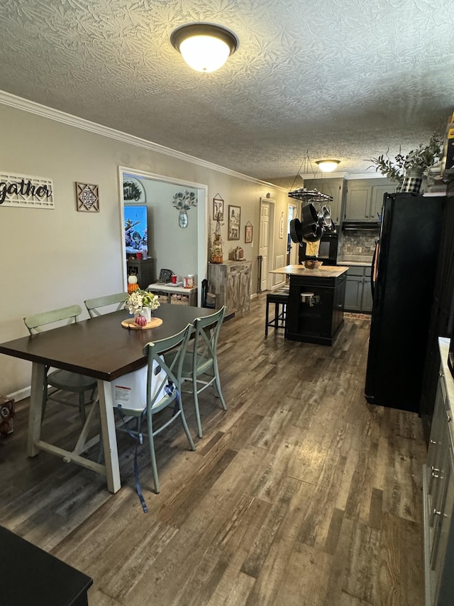 1304 Ellington Dr, Lafayette, TN 37083 - dining room with dark wood-type flooring, crown molding, and a textured ceiling