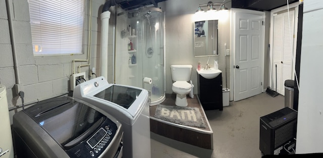 1304 Ellington Dr, Lafayette, TN 37083 - bathroom featuring washer / clothes dryer, a shower stall, vanity, and concrete floors