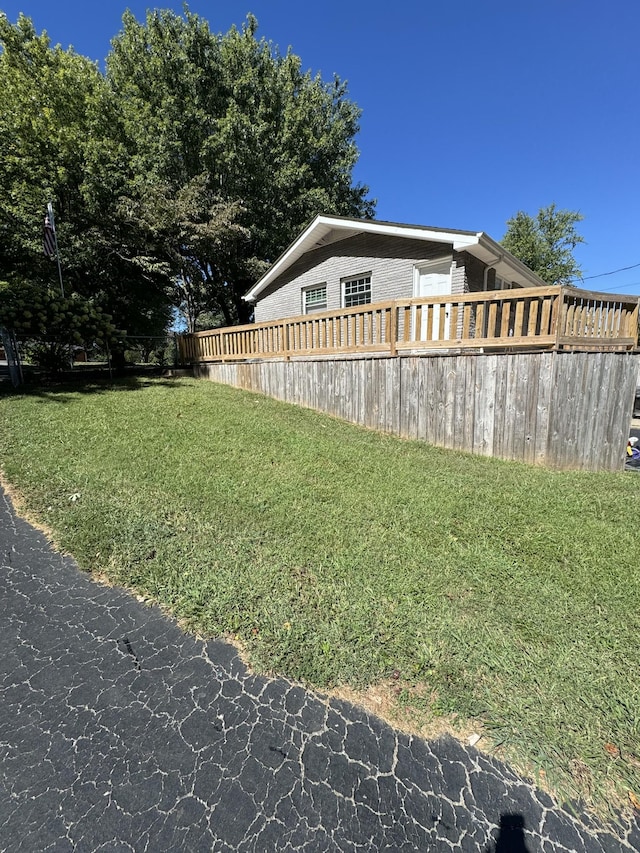 1304 Ellington Dr, Lafayette, TN 37083 - view of home's exterior with a lawn