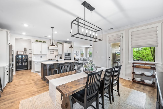 141 Foxhall Dr, Spring Hill, TN 37174 - dining room with ornamental molding, light wood finished floors, and recessed lighting