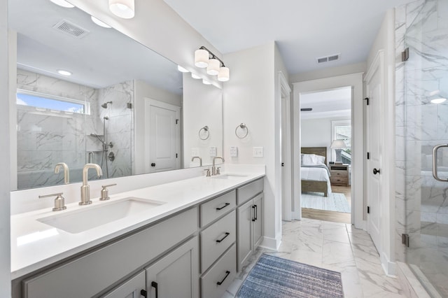 141 Foxhall Dr, Spring Hill, TN 37174 - ensuite bathroom featuring marble look tiles, double vanity, and a marble finish shower
