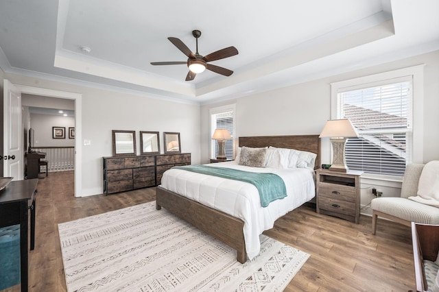 141 Foxhall Dr, Spring Hill, TN 37174 - bedroom featuring a tray ceiling, wood finished floors, and ceiling fan