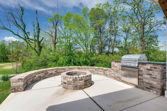 141 Foxhall Dr, Spring Hill, TN 37174 - view of patio / terrace with exterior kitchen and an outdoor fire pit