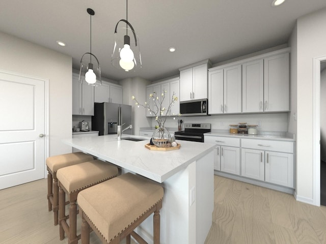 1517 Bear Branch Trce, Columbia, TN 38401 - kitchen featuring stainless steel appliances, recessed lighting, hanging light fixtures, an island with sink, and a kitchen bar