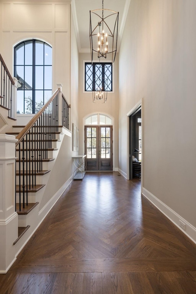 7521 Whiskey Rd, College Grove, TN 37046 - entrance foyer featuring a chandelier, stairs, french doors, ornamental molding, and a towering ceiling