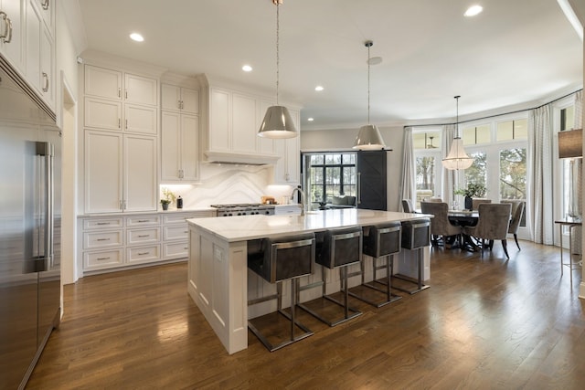 7521 Whiskey Rd, College Grove, TN 37046 - kitchen featuring built in fridge, dark wood-style flooring, tasteful backsplash, white cabinets, and recessed lighting