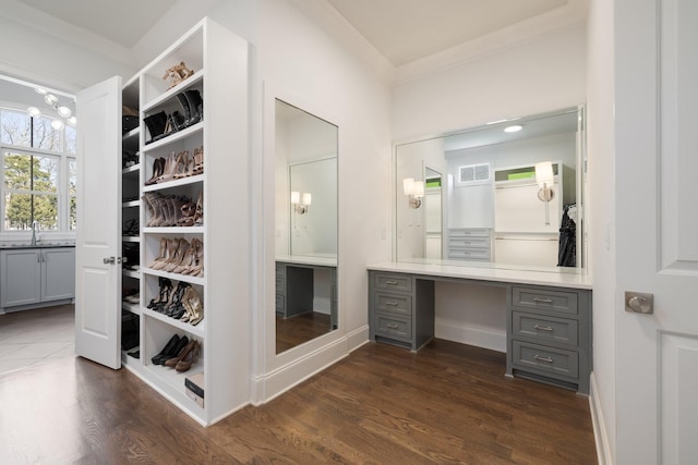 7521 Whiskey Rd, College Grove, TN 37046 - walk in closet featuring dark wood-type flooring and built in study area