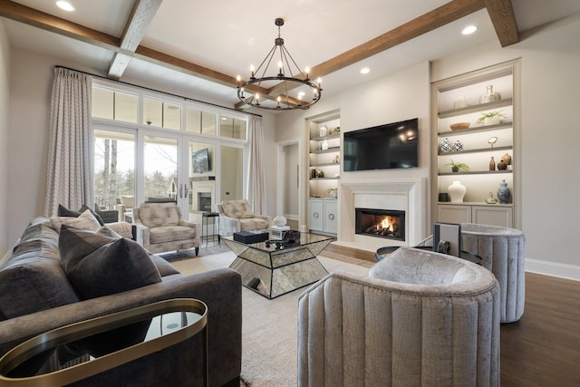 7521 Whiskey Rd, College Grove, TN 37046 - living area with a glass covered fireplace, recessed lighting, wood finished floors, beam ceiling, and a chandelier