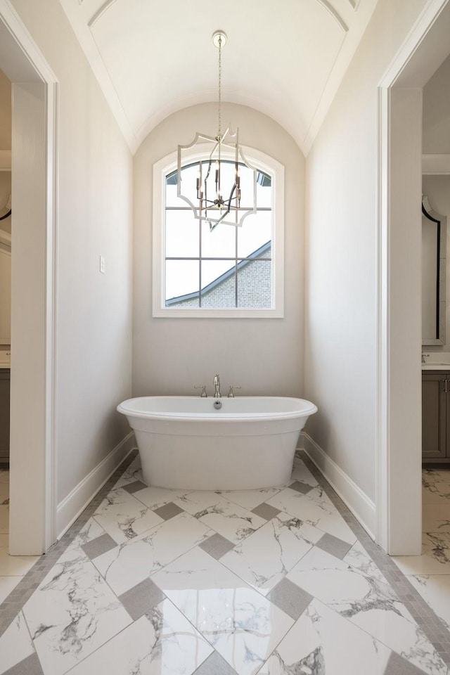 7521 Whiskey Rd, College Grove, TN 37046 - full bath featuring marble finish flooring, a freestanding tub, and a chandelier