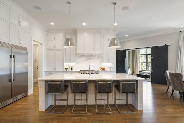 7521 Whiskey Rd, College Grove, TN 37046 - kitchen featuring built in refrigerator, backsplash, white cabinets, dark wood-type flooring, and pendant lighting