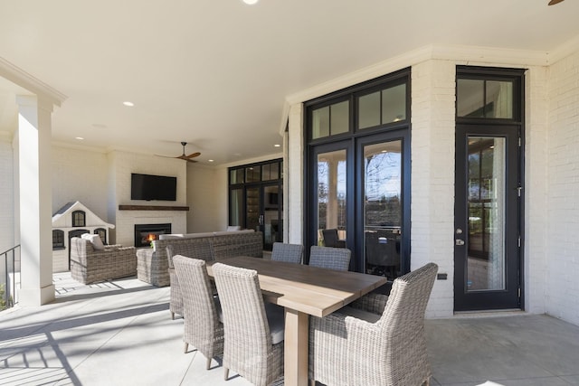 7521 Whiskey Rd, College Grove, TN 37046 - view of patio with a lit fireplace and a ceiling fan