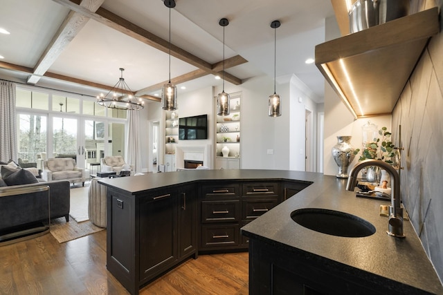 7521 Whiskey Rd, College Grove, TN 37046 - kitchen featuring dark countertops, open floor plan, wood finished floors, beam ceiling, and recessed lighting