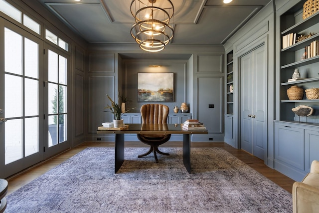 7521 Whiskey Rd, College Grove, TN 37046 - office featuring a decorative wall, healthy amount of natural light, built in shelves, ornamental molding, and wood finished floors