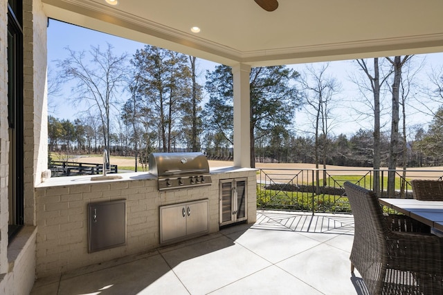 7521 Whiskey Rd, College Grove, TN 37046 - view of patio featuring exterior kitchen and view of scattered trees